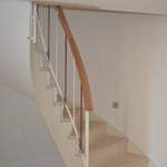 steep double curved handrail on steep staricase