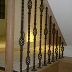 Diminishing handrail and metal spindles